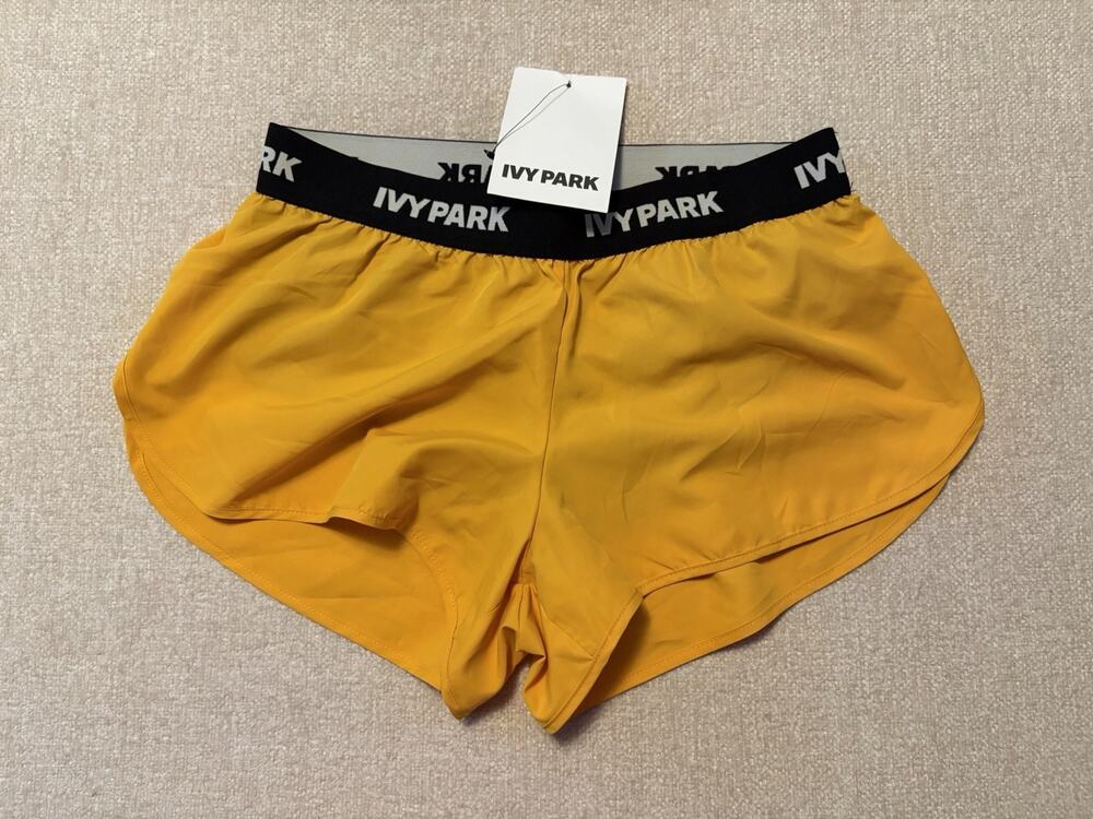 IVY PARK Logo Tape Lined Running Shorts Yellow Size Small Workout Gym New
